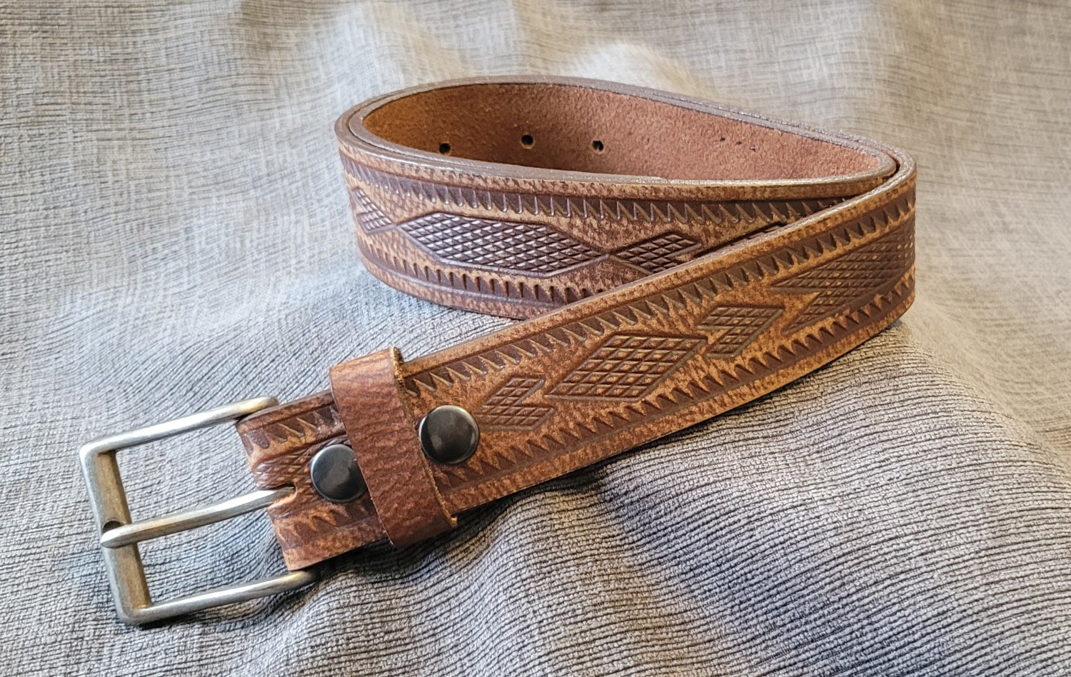 Brown leather belt with intricate patterns-tooling 